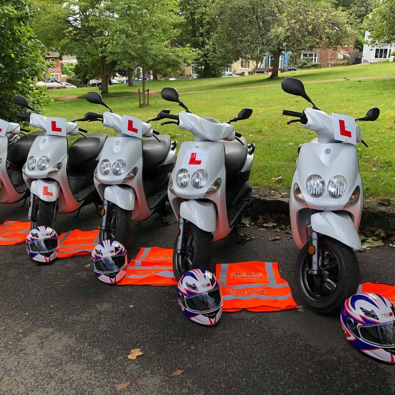 A row of scooters with L plates on